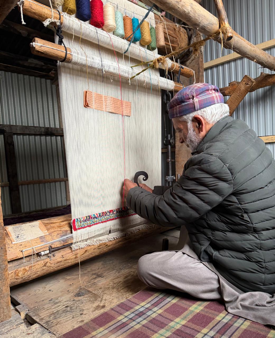 Artisan working at a loom in Kashmir
